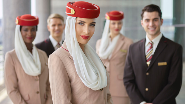 Emirates uniformed employees group close up