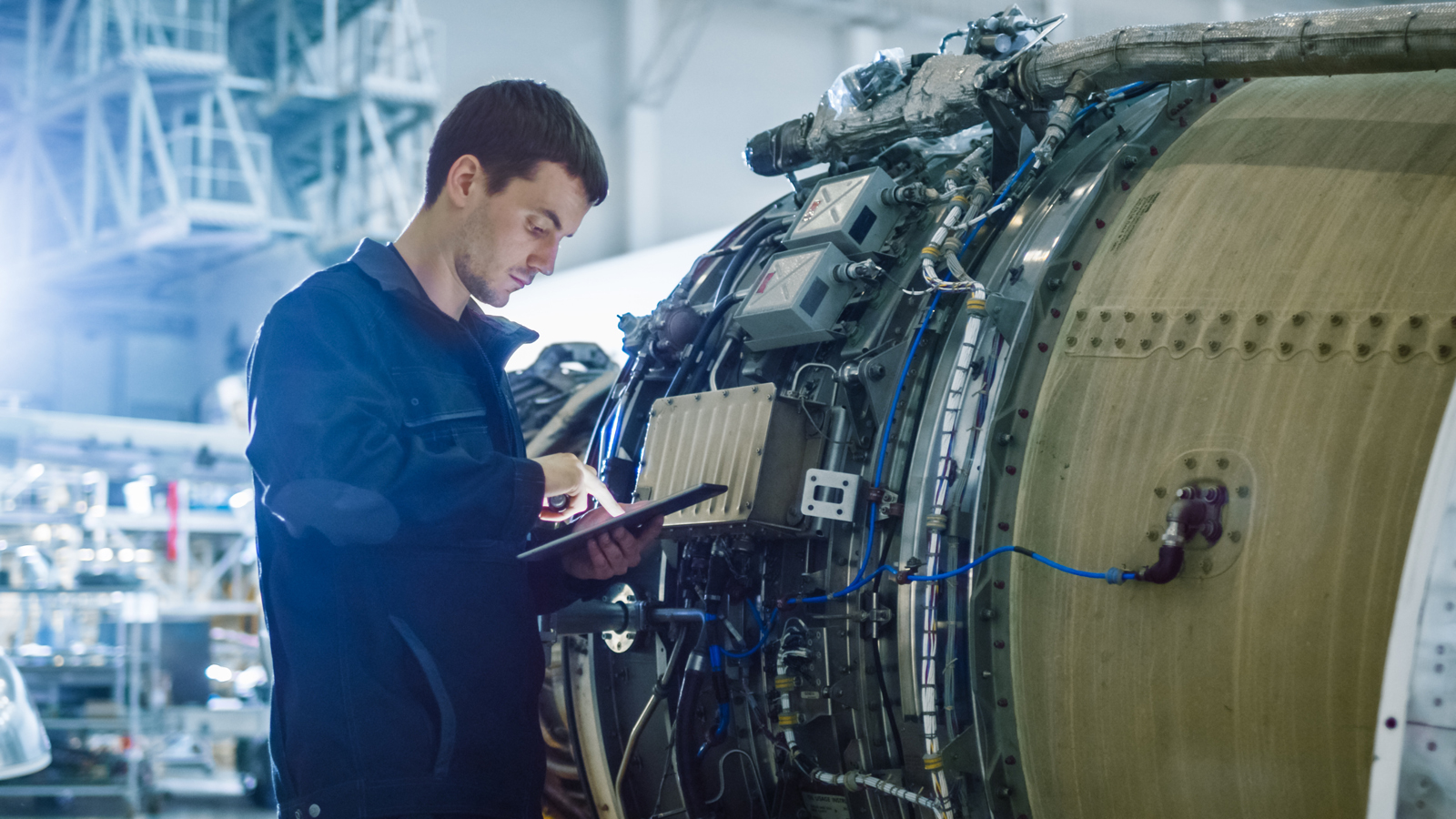 Aircraft Maintenance Mechanic Inspecting and Working on Airplane