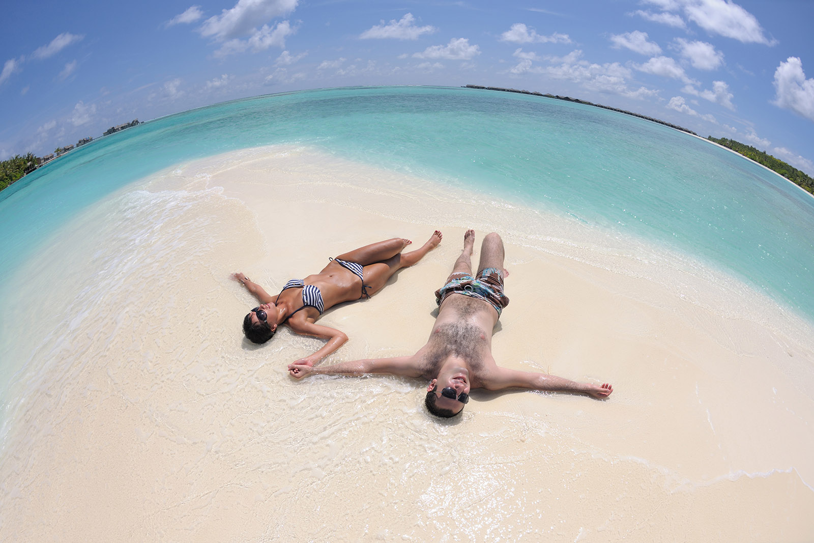 happy young couple have fun on beach