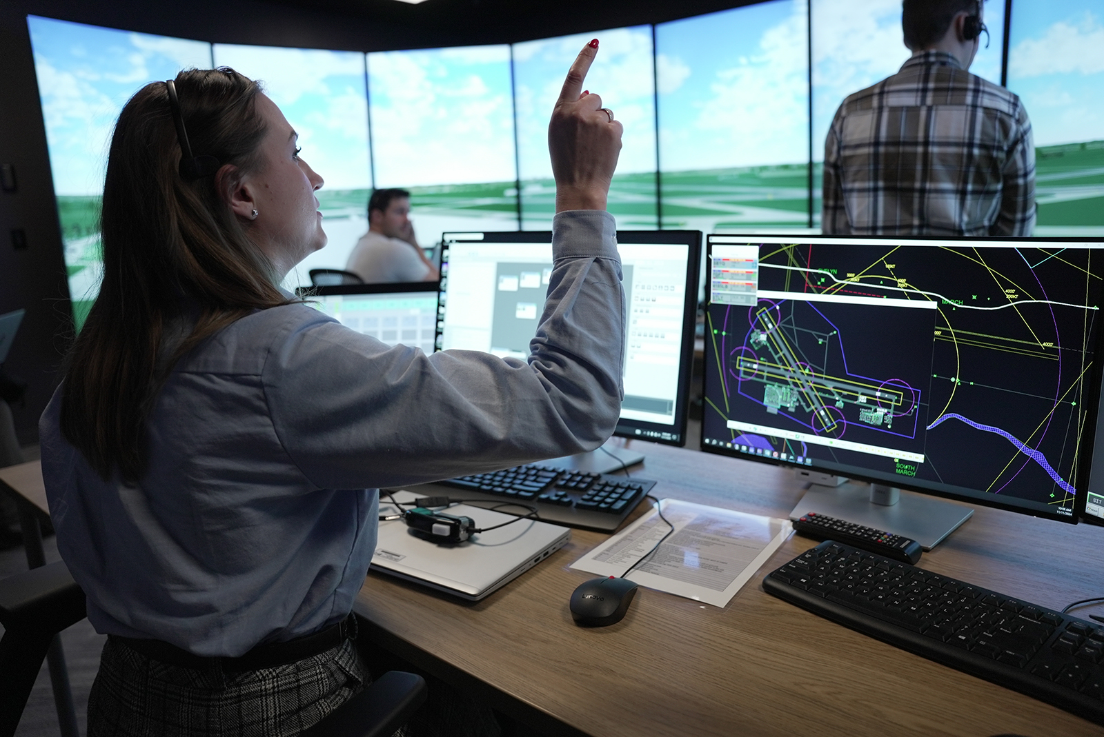 Instructor_and_students_in_the_simulator_room_at_CAE_s_Air_Traffic_Services_Training_Centre