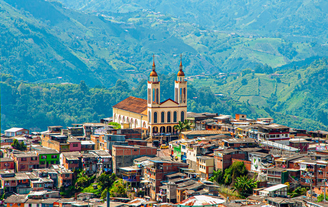 Parroquia Nuestra Señora del Carmen. Manizales, Caldas, Colombia. Panoramic view of the city, its houses, buildings and the mountains.